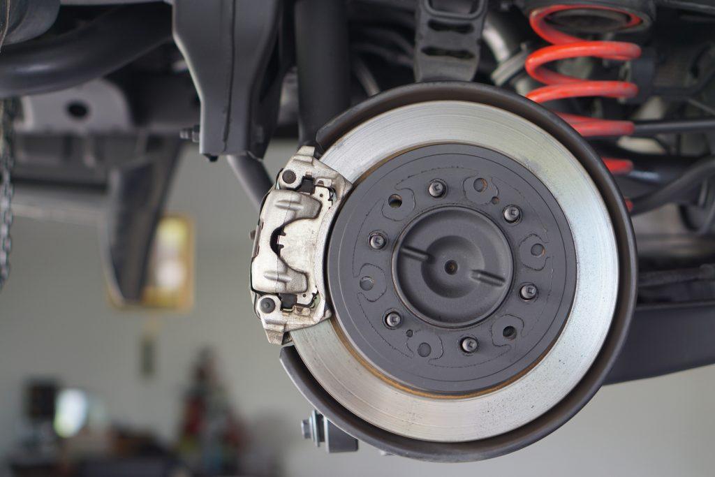 image of rotors and pads attached to the vehicle. A brake service is about to be performed  